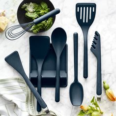 kitchen utensils laid out on a marble table