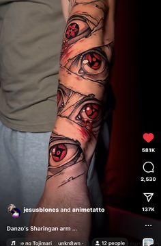 an arm with some red eyes on it