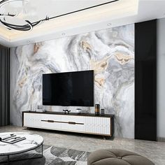 a modern living room with marble walls and flooring, including a large flat screen tv