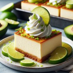 a slice of key lime cheesecake on a plate with sliced limes around it