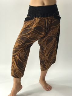 "Samurai Pants (Unisex) Elastic Waist - Fits all ! MATERIAL: 100% Cotton APPROX MEASUREMENT: Measurements - 1 inch (1\") = 2.54cm. Waist: 24\"- 40\" Length: 28\" Around Ankle : 18 inch (Reference of the model) Tall 5'8\" Waist 33\" Category: harem pants, Japanese, ninja pants, pants, samurai, samurai pants, samurai-pants-elastic-waist, thai pants Shipping & Handling * Parcels will be ship via DHL Express FEATURE: Handmade Ethically, Breathable, Unisex, Comfortable to Wear & Stylish. SIZE Brown Cotton Harem Yoga Pants, Brown Harem Pants For Yoga, Brown Harem Yoga Pants, Brown Harem Bottoms For Yoga, Casual Brown Harem Yoga Pants, Casual Brown Harem Pants For Yoga, Pantalon Thai, Japanese Ninja, Martial Arts Uniform