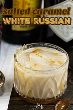 a white russian drink in a glass on a wooden table