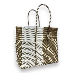 Indulge in luxury with our Duo tote, featuring the timeless Maria Victoria Bag in a captivating handwoven design. Made from repurposed plastic, this versatile bag is perfect for poolside lounging, beach outings, grocery excursions, and everyday tasks. With easy cleaning and fade-resistant colors, you'll never want to leave without it. Measurements: length x depth x height with handle length Extra Large(OT): 17.5x8x18.5 inches with 8 inch handles Large(OR): 15.5x7.5x15 with 8 inch handles Medium( White Rectangular Beach Bag With Open Weave, White Rectangular Woven Leather Straw Bag, White Open Weave Bags For Everyday Use, White Recyclable Beach Bag For Shopping, Eco-friendly White Open Weave Bag, Everyday White Open Weave Bags, White Open Weave Rectangular Bag, White Open Weave Rectangular Beach Bag, White Woven Leather Straw Bag For Shopping