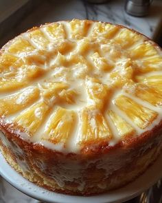 there is a cake with pineapple slices on it