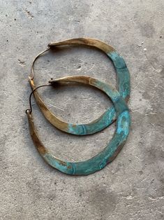 "Solid 8 gauge brass has been hand-hammered into large hoops. I then added several layers of grungy turquoise patina and oxidized the entire hoop for a rustic look. Hypoallergenic niobium earwires 2.5\" wide and 2.75\" long Handmade in NY" Bronze Hoop Pierced Earrings, Artisan Metal Hoop Jewelry, Unique Small Hoop Copper Earrings, Brass Hoop Wrap Earrings, Artisan Hoop Earrings For Pierced Ears, Bronze Hoop Earrings For Jewelry Making, Handmade Bronze Hoop Jewelry, Hand Forged Bronze Small Hoop Jewelry, Bronze Hoop Earrings With Ear Wire