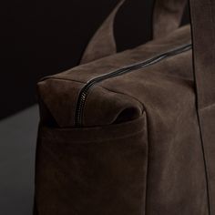 Our modern and sleek duffle bag is made from Italian calf suede with contrast hand glazed edges and is functionally designed, becoming the essential every day or travel ready bag. Additional Information:• Italian Calf Suede • Fully lined with internal zippered pocket• Side Welt Pockets• Length: 21.8", Width: 8.6" Height: 15.75"• Top Handle Drop: 9"• Removable Grosgrain adjustable shoulder strap Weekend Bag, Weekender Bag, Welt Pockets, Welt Pocket, Duffle Bag, Every Day, Shoulder Strap, Angeles, Sleek