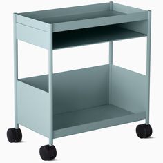 a small blue cart with wheels on the bottom and one shelf open to show items