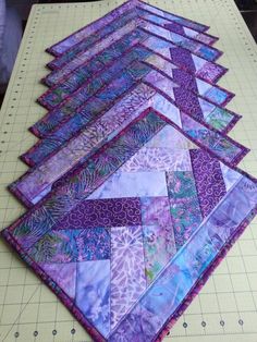 the quilts are laid out and ready to be sewn together on the table