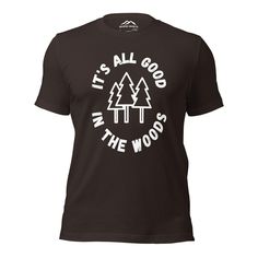 Step into the tranquility of nature with our "Good in the Woods" t-shirt. Crafted with 100% combed and ring-spun cotton (Heather colors contain polyester), this shirt ensures optimal comfort and quality. The shirt reminds you of the peace and contentment found amidst the trees. Whether you're camping, hiking, or simply enjoying the great outdoors, let this shirt be a reflection of your love for nature and the blissful moments it brings. Embrace the serenity of the woods and wear it with pride! Unisex sizing fits true to size. Nature-inspired Cotton T-shirt With Screen Print, Graphic Tee T-shirt For Camping, Crew Neck T-shirt With Screen Print For Camping, Black Graphic Print T-shirt For Camping, Cotton T-shirt With Text Print For Camping, Camping Text Print Crew Neck T-shirt, The Great Outdoors, Bring It On, Let It Be