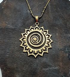 HANDMADE Stunning statement Star Mandala, sacred geometry pendant with a complementary chain. Made by hand with hight quality of brass, Nickel free.  SIZE Aprox pendant height: 5.5 cm Aprox Pendant Width: 4.4 cm LINK Don't miss the rest of the collection, please follow the link.  https://www.etsy.com/uk/shop/JagathaStudio Handmade Brass Amulet Charm Necklaces, Handmade Brass Amulet Style Charm Necklaces, Spiritual Bronze Metal Jewelry, Festival Brass Jewelry With Adjustable Chain, Spiritual Metal Necklaces, Handmade Spiritual Metal Charm Necklaces, Spiritual Metal Charm Necklaces, Spiritual Brass Pendant Necklace, Handmade Brass Pendant Charm Necklaces