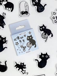 some black and white stickers with cats on them