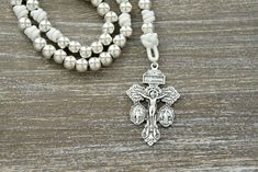 Elevate your spiritual connection with the "Divine Elegance" Paracord Rosary, a perfect blend of strength and grace. This exquisite rosary is a testament to the enduring faith within you, meticulously handcrafted with 10mm alloy metal beads that radiate elegance and durability. As each bead shines brilliantly in the light, "Divine Elegance" exudes a timeless charm that's reminiscent of a heavenly gift. Drenched in purity and symbolism, this rosary boasts all-silver colored beads, elegantly paire Paracord Rosary, Gift From Heaven, Miraculous Medal, Metal Beads, Rosary, Paracord, Beads, Silver, Gifts