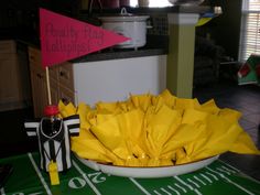 a bowl full of yellow umbrellas sitting on top of a table