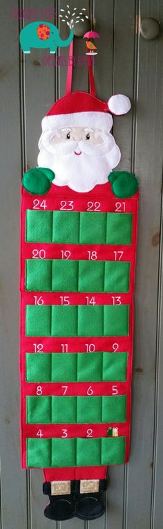 a santa clause hanging from the side of a door with numbers and times on it