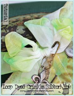 a green and white bow with scissors on it