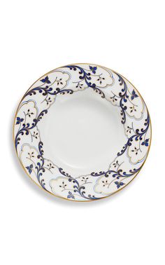 an ornate blue and white plate with gold trimmings on the rim, set against a white background