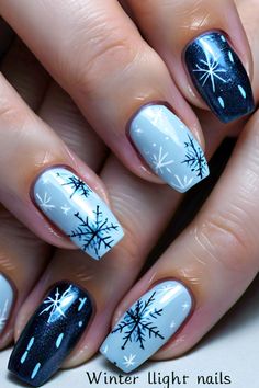 Stay stylish this winter with these gorgeous snowflake nails in light blue and dark accents. Nail inspiration for the cold weather! Light Blue And Dark Blue Nails, Dark Blue Winter Nails, Snowy Nails, Blue Winter Nails, Dark Blue Nails, Pedicure Ideas, Chic Nail Art, Weak Nails, January Nails