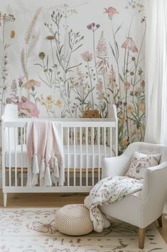 a baby's room with a white crib and floral wallpaper