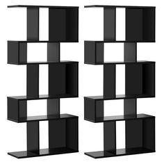 three black shelving units with shelves on each side