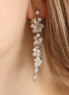 These crystal drop earrings are so delicate, yet have a statement length of 2.5 inches. They are intricately beaded with cubic zirconia crystals, Swarovski bicone crystals, and tiny freshwater pearls. I can make them in silver, gold, or rose gold metal. I love to create custom jewelry so please contact me if you would like any changes. I make the pieces by hand so I can customize the shape, color, etc. for you! Featured in the listing pictures is the matching bracelet, made with the same smaller Silver Crystal Drop Bridal Earrings, Elegant Sparkling Long Drop Chandelier Earrings, Party Pearl Drop Chandelier Earrings In Cubic Zirconia, Party Chandelier Earrings With Pearl Drop And Cubic Zirconia, Elegant Dangle Crystal Embellished Earrings, Elegant Long Drop Chandelier Earrings With Sparkling Stones, Silver Crystal Earrings With Pearl Drop, Elegant Sparkling Crystal Dangle Earrings, Pearl Drop Cubic Zirconia Crystal Earrings