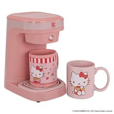 a pink hello kitty coffee maker and mug