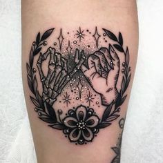 a black and white tattoo design on the leg