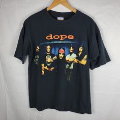 Dope Heavy Metal Vintage Band T Shirt Size Large L Black Punk Grunge Goth Tee. Dope Heavy Metal Band Shirt Is Pre-Owned With Wear. Size Large (Width 21", Length 28"), See Photos For Details. Make Sure To Follow Us! We Ship Every Day The Post Office Is Open! 90s Style Black Deadstock Tops, Black Band Logo Top For Alternative Fashion, Black Band Logo Tops For Alternative Fashion, Black Tops With Band Logo For Alternative Fashion, Halloween Black Deadstock Tops, Black Punk Band Logo Tops, Black Punk Band Logo Top, Punk Black Top With Band Logo, Punk Style Black Top With Band Logo