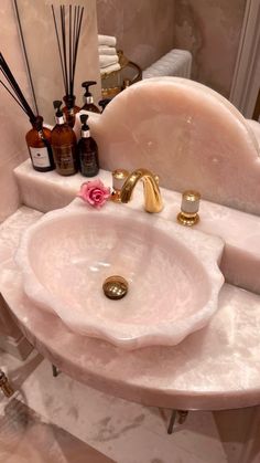 a bathroom sink with soap and lotion on it