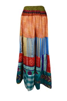 Infuse your wardrobe with seasonal charm with this stunning flared maxi skirt! Expertly crafted from upcycled saree fabric, it boasts vibrant shades of Red, Multi, and an eye-catching array of patterns, making each piece truly one-of-a-kind. The ankle-length design and adjustable drawstring waist ensure a comfortable, flattering fit, perfect for casual strolls at the farmer's market or dancing under the stars at beachside gatherings. Handmade with a focus on sustainability, this boho-chic skirt Hippie Multicolor Maxi Skirt, Bohemian Maxi Skirt For Festive Occasions, Multicolor Bohemian Maxi Skirt For Festivals, Bohemian Multicolor Maxi Skirt For Festivals, Bohemian Maxi Skirt For Summer Festivals, Traditional Multicolor Maxi Skirt, Red Flowy Maxi Skirt For Festival, Multicolor Maxi Length Festival Bottoms, Traditional Multicolor Flowy Maxi Skirt