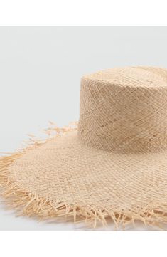 Raw-edged raffia brings a beautifully boho vibe to a wide-brimmed hat that will shade your face with style. Raffia Imported Handwoven Flat Brim Straw Hat For Vacation, Bohemian Palm Leaf Boater Hat For Vacation, Spring Vacation Straw Hat In Natural Fiber, Spring Beach Straw Hat, Handwoven Flat Brim Boater Hat For Vacation, Natural Woven Wide Brim Boater Hat, Bohemian Wide Brim Sun Hat In Jute, Natural Wide Brim Woven Boater Hat, Summer Wide Brim Jute Sun Hat