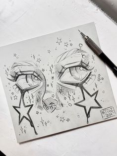 a pencil drawing of two faces with stars on the forehead and one has eyes open