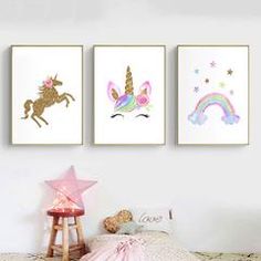 three unicorns are hanging on the wall next to a pink star and a white bed