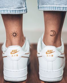 a woman's foot with a tattoo on her left ankle and the word air written in gold ink