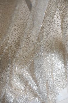 Beautiful sparkle Tulle with Gold Glitter Soft Tulle hand feel This is a new style in high quality. Great for wedding dress, evening gown, Costume, cocktail dress, flower girl dress This Listing is sell for fabric, not include the dresses Color: Ivory with Gold Glitter, Ivory with Silver Glitter Width - 51 inches, Length - 1 Yard Wholesale acceptable, please convo me Shipping Time: United Sates: 10-15 working days United Kingdom:10-15 working days Canada: 10-15working days Australia: 10-15 worki Gold Sequin Fabric, Wedding Dress Evening, Fabric Glitter, Bridal Wedding Dress, Bridal Fabric, Gold Champagne, Shiny Fabric, Glitter Wedding, Blue Sparkles