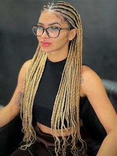 Center-Parted Long Tribal Braids Blond Cornrows Braids, Jumbo Blonde Knotless Box Braids, Afro Braids Blonde, Braids On Blonde Hair, Blond Fulani Braids, Blonde Braided Hairstyles, Middle Part Braids, Braids Blonde Hair, Blonde Fulani Braids