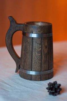 a wooden mug sitting on top of a table