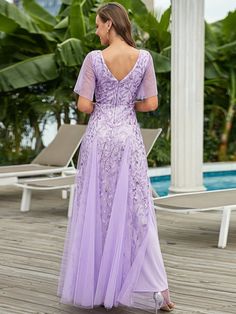 This Dress is fashionable for every occasion. the dress is made-to-order by professional tailors. You can choose from 50 colors, Regular sizes 2 to 16 and plus sizes 14w to 26W. Custom size is also available. Lavender V-neck Dress For Formal Occasions, Elegant Lavender A-line Dress, Purple V-neck Dress For Wedding Guest, Lavender V-neck Bridesmaid Dress, Elegant Lavender Maxi Dress With Ruffles, Elegant Purple Wedding Guest Gown, Lavender Short Sleeve Formal Dresses, Elegant Lavender Dresses For Banquet, Purple Short Sleeve Maxi Dress For Wedding