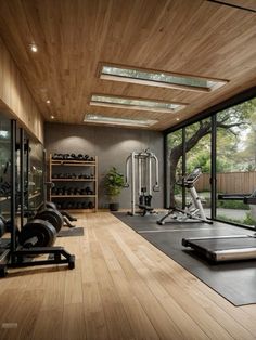 a home gym with treadmills and exercise equipment in the foreground, surrounded by large windows