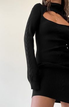 COLOR: BLACK DETAILS Mini length Cable knit fabric Slim fit Fold over turtleneck Chest cutout detail 65% Viscose, 25% Polyester, 10% Nylon Please refer to the care label for garment care instructions SIZE & FIT: runs TTS, model wears size S MODEL INFO: HEIGHT 5’7, WAIST 24in, BUST 32in Winter Outfit Inspo 2022, Fall Black Knit Mini Dress, Black Turtleneck Sweater Dress With Stretch, Black Stretch Turtleneck Sweater Dress, Fitted Black Open Knit Dress, Fitted Black Turtleneck Sweater Dress, Black High Neck Stretch Sweater Dress, Black Stretch High Neck Sweater Dress, Black Fitted Turtleneck Sweater Dress