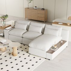 a modern living room with white furniture and black and white checkered rugs on the floor