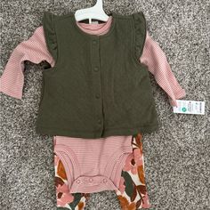 Fall Outfit. Floral Pants. Striped Long-Sleeve Onesie. Green Vest. Cotton Sets For Playtime In Fall, Playful Playwear Sets For Fall, Green Matching Set For Fall, Fall Green Matching Set, 3-piece Long Sleeve Sets For Spring, Long Sleeve Playtime Sets With Pockets, Cute Spring Sets With Pockets, Casual 3-piece Set For Spring, Pink Matching Set For Fall