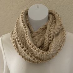 I knit this pretty Infinity scarf Cowl in a 100% Acrylic yarn in a Solid Beige Colored Yarn This Cowl may be worn many different ways.  Medium weight cowl, Eyelet design Measures 48" around  X 12" wide. It will stretch some when twisted and wrapped. Wide enough to pull up over your head. Machine wash gentle cold, dry low heat. Solid Beige, Infinity Cowl, Infinity Scarf, Warm Winter, Acrylic Yarn, Medium Weight, Scarf Wrap, Hand Knitting, Scarf Accessory