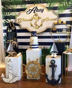 an assortment of nautical themed cakes on display in front of a sign that says ahoy