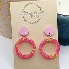 These Pink round earrings are the perfect set of earrings for everyday wear. They are made from Resin and Glitter. They would make the perfect gift for someone special. Please note - The glitters and colours in the earrings maybe different slightly from the photos because of lighting ect but i do my best to make sure they are very similar. If you have any questions, please message me. Happy shopping OTHER INFORMATION Shipping: Domestic Shipping will take 1 to 6 days - Express Shipping is available at an extra cost. International Shipping will take 6 to 10 Business Days - Express Shipping is available at an extra cost. Items can be posted within 14 Days Personalised Orders: Custom orders are not returnable, refundable or exchangeable due to their personalised nature. Colour: Actual colour m Handmade Pink Circular Earrings, Handmade Pink Circle Earrings, Pink Round Earrings For Birthday, Pink Round Birthday Earrings, Handmade Round Earrings For Birthday, Pink Circle Earrings As A Gift, Pink Circle Earrings For Gift, Pink Circle Earrings For Gifts, Hypoallergenic Round Earrings For Birthday