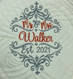 an embroidered wedding pillow with the words mr and mrs walker on it's side