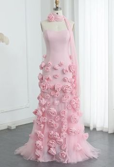 This gown is a striking shade of pink, featuring a strapless design with a sweetheart neckline that elegantly accentuates the collarbone and shoulders. The standout feature of the gown is the intricate 3D rose detailing, which adds a touch of romance and sophistication. The gown is complemented by a matching 3D rose neck choker, creating a cohesive and eye-catching look. This outfit is perfect for a formal event or a special occasion where you want to make a memorable impression.  Production tim 3d Flower Fashion, Rose Inspired Outfits, Pink Christmas Dress, Pink Princess Gown, 3d Flower Dress, Pink Rose Dress, Flower Prom Dress, Prom Dress With Train, Glam Dress