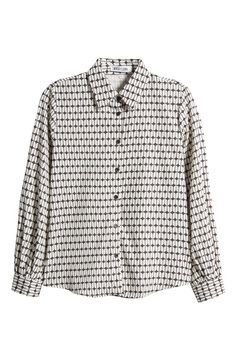 An eye-catching geo print emboldens this desk-to-dinner shirt. Spread collar Long sleeves 100% polyester Hand wash, dry flat Made in the USA Patterned Spread Collar Top For Work, Patterned Collared Shirt For Workwear, Patterned Blouse With Button Closure For Work, Patterned Collared Blouse For Work, Collared Patterned Blouse For Work, Long Sleeve Shirt With Geometric Pattern For Work, Modern Tops With Geometric Pattern For Workwear, Modern Tops With Geometric Pattern For Work, Modern Shirt With Geometric Pattern For Workwear