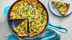 an omelet with broccoli and mushrooms in a pan