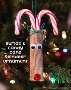 an ornament made out of burlap and candy canes on a christmas tree