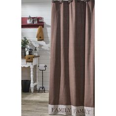 a brown and white checkered shower curtain with the word family on it's side